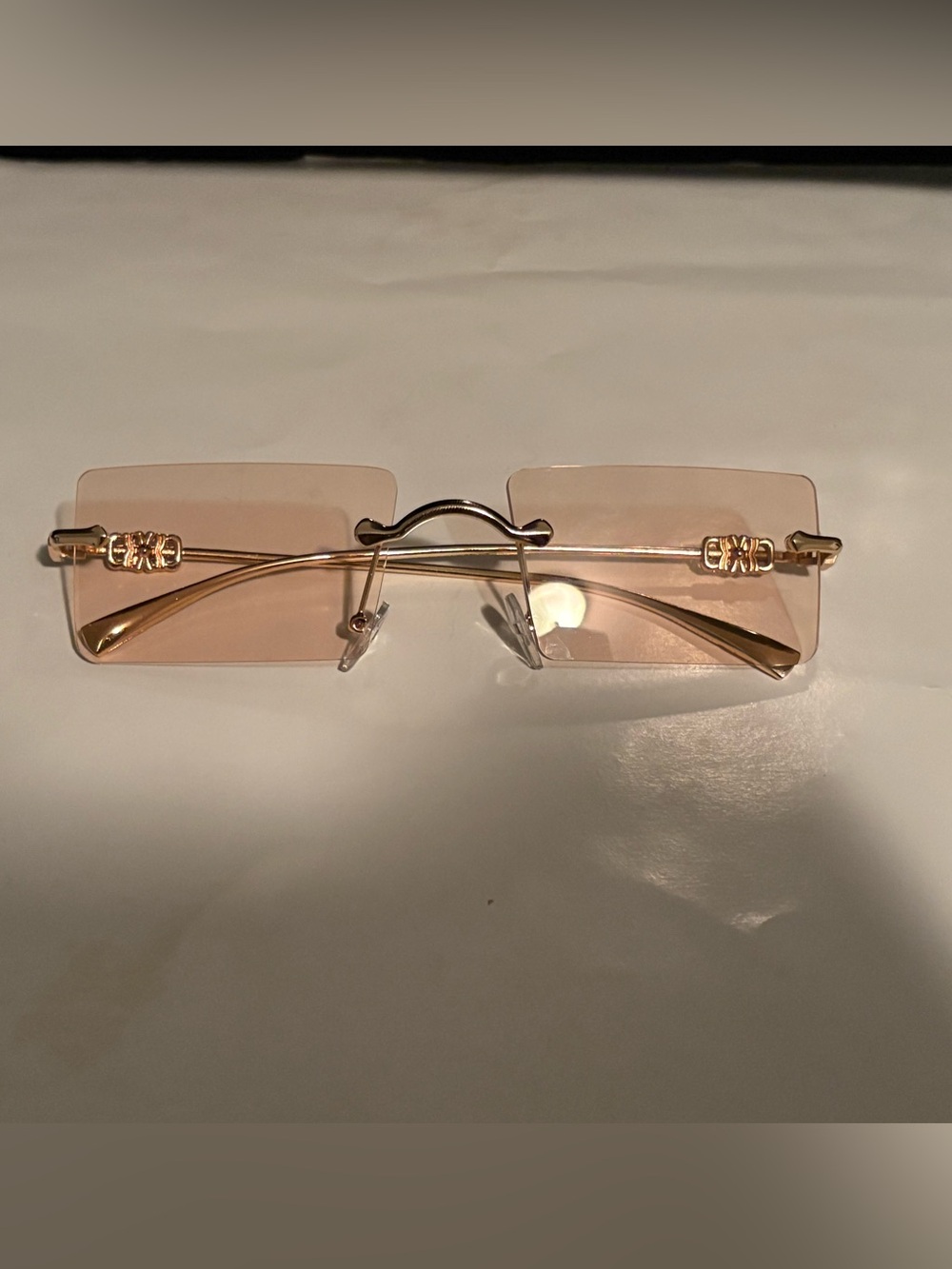 Rimless Pink-Tint Fashion Sunglasses with Gold Arms